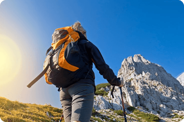 Traveler with backpack on mountain